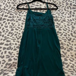 green mini dress with slit at bottom and lace back
